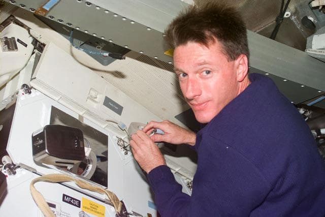 NASA image: MS Foale performs maintenance on middeck