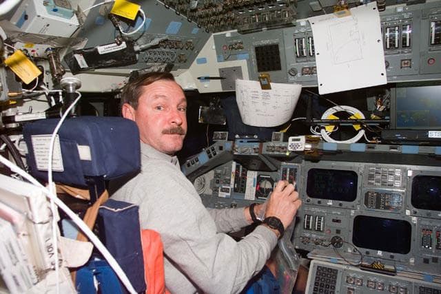 NASA image: CDR Black at his station on the flight deck
