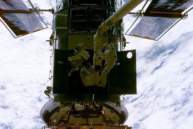 NASA image: EVA 1 - Grunsfeld and Smith during RSU changeout