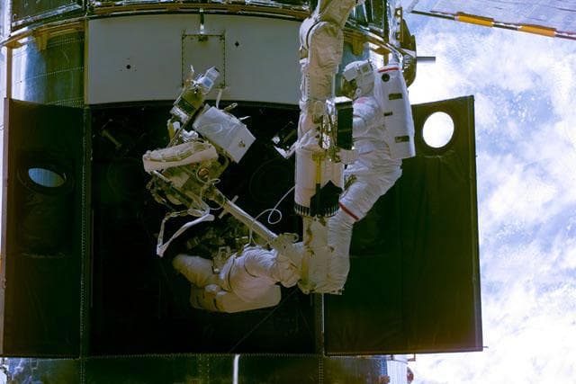NASA image: EVA 1 - Grunsfeld and Smith during RSU changeout