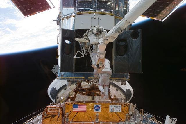 NASA image: EVA 1 - Grunsfeld and Smith during RSU changeout