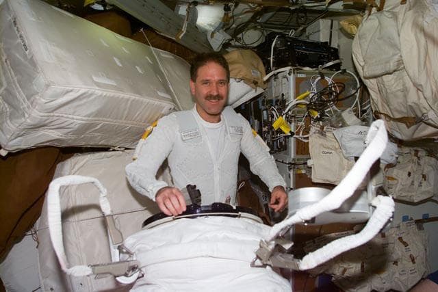 NASA image: MS Grunsfeld prepares for first EVA