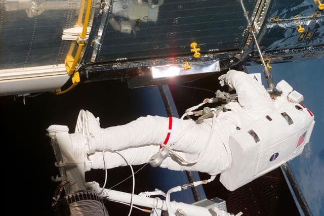 NASA image: EVA-2 - Foale on RMS with power tool