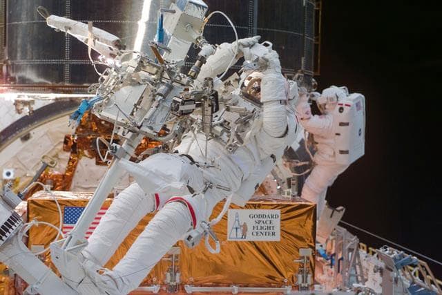 NASA image: EVA-3 - Smith and Grunsfeld work with the HST