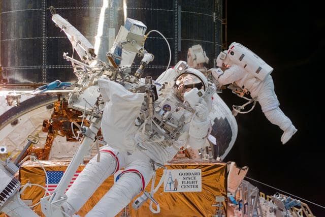 NASA image: EVA-3 - Smith and Grunsfeld work with the HST