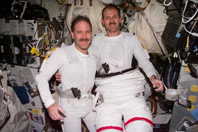 NASA image: EVA-3 preparation - Smith and Grunsfeld on the middeck