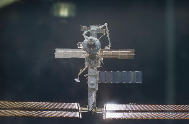NASA image: ISS during approach by STS-104 orbiter Atlantis