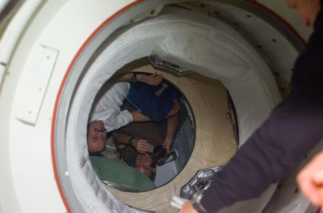 NASA image: Expedition Two crew  greet STS-104 crew at PMA-2 hatch