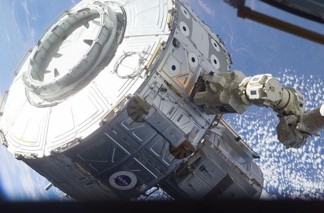 NASA image: Quest airlock maneuvered into position