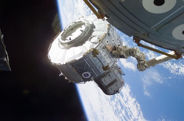 NASA image: Quest airlock maneuvered into position