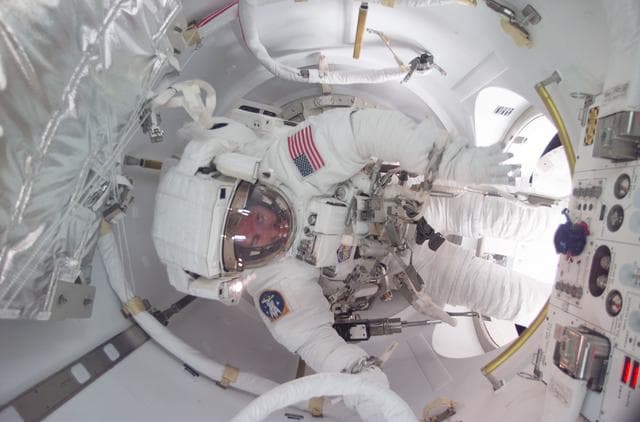 NASA image: MS Reilly in airlock at the end of the third EVA