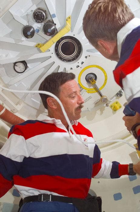 NASA image: Horowitz and Culbertson prepare to open the ODS hatch into the ISS