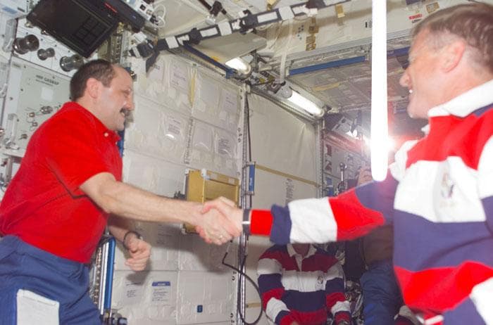 NASA image: Usachev and Culbertson shake hands in the ISS U.S. Laboratory
