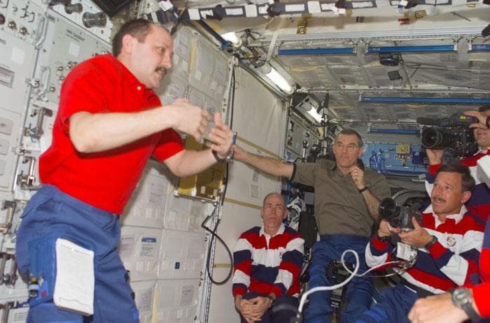 NASA image: Usachev greets the Expedition Three and STS-105 crew