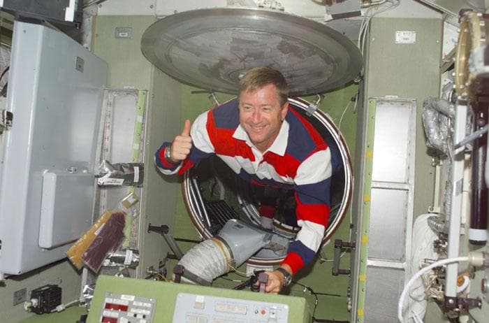 Culbertson floats through a hatch into the ISS Service Module/Zvezda