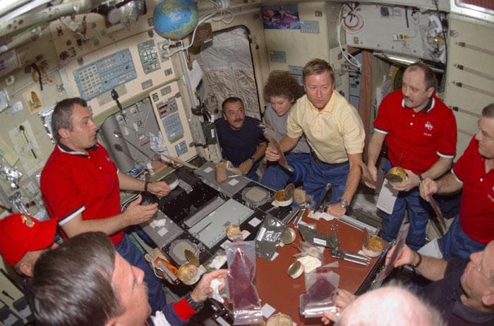 NASA image: Meal for Expedition Two, Three and STS-105 crews in the ISS Service Module/Zvezda