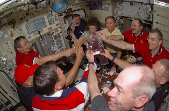 NASA image: Meal for Expedition Two, Three and STS-105 crews in the ISS Service Module/Zvezda