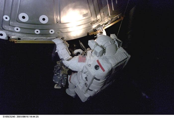 NASA image: Barry translates along handrails on ISS U.S. Laboratory/Destiny during the first EVA