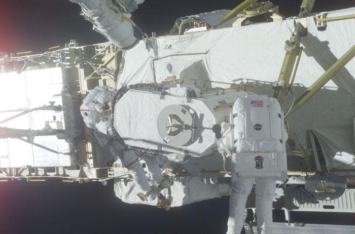 NASA image: Barry and Forrester stow the EAS on the P6 Truss