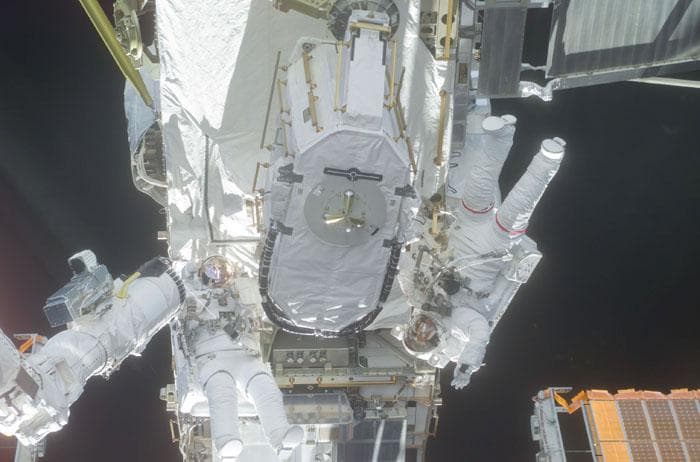 NASA image: Barry and Forrester stow the EAS on the P6 Truss