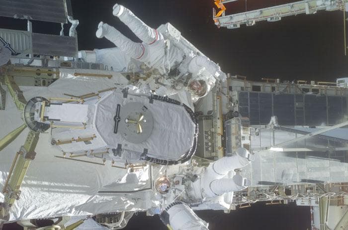 NASA image: Barry and Forrester stow the EAS on the P6 Truss