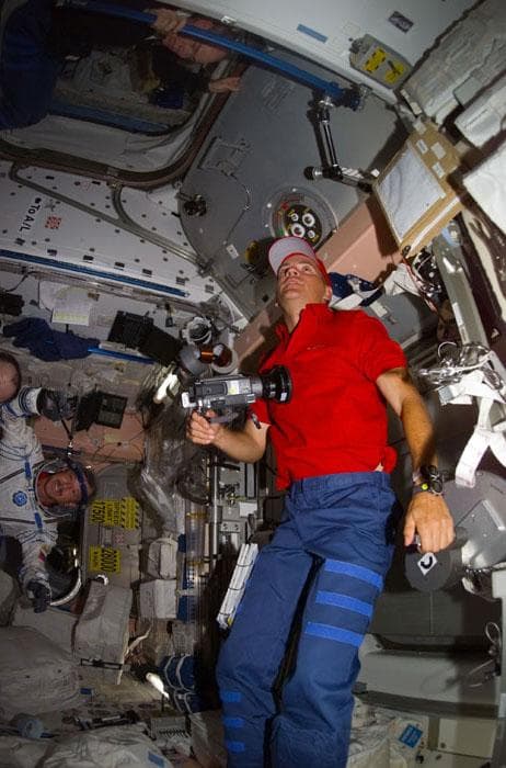 NASA image: Sturckow with video camera talks with Barry