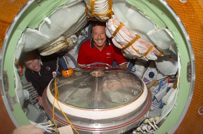 NASA image: Horowitz and Barry inside Soyuz spacecraft with Sokol suits