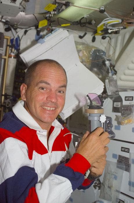 NASA image: Sturckow on the orbiter middeck with COAS equipment
