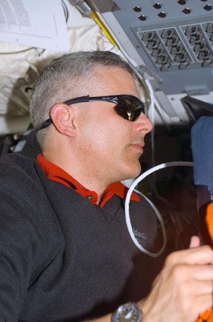 NASA image: MS Morin works on the aft flight deck of Atlantis during STS-110