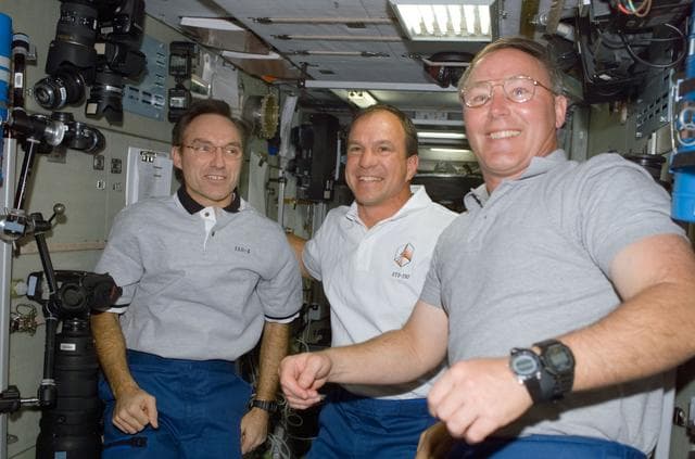 NASA image: Walz, Bloomfield and Ross congregate in Zvezda during STS-110's visit to the ISS