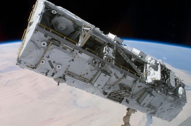 NASA image: View of the S0 Truss being moved into installation position by the SSRMS during STS-110
