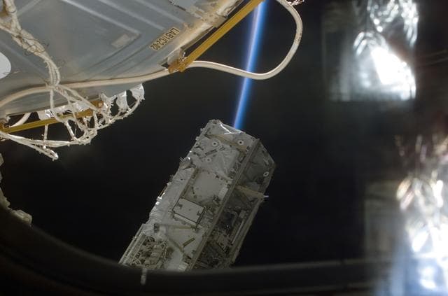 NASA image: View of the S0 Truss being moved into installation position by the SSRMS during STS-110