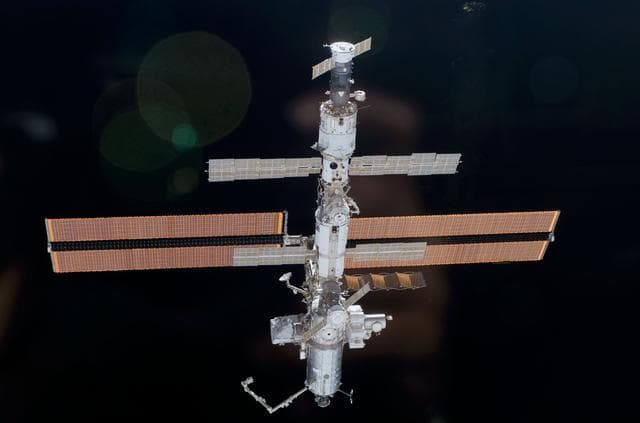 NASA image: Aft view of the ISS taken during STS-110's undocking and final flyaround