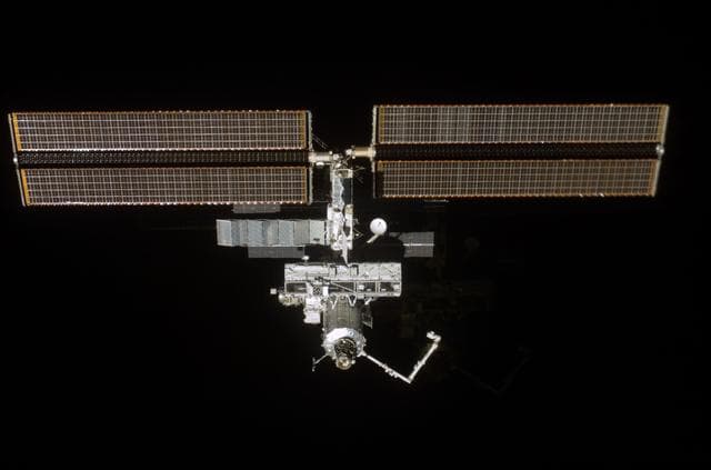 NASA image: Forward - zenith view of the ISS taken during STS-110's undocking and final flyaround
