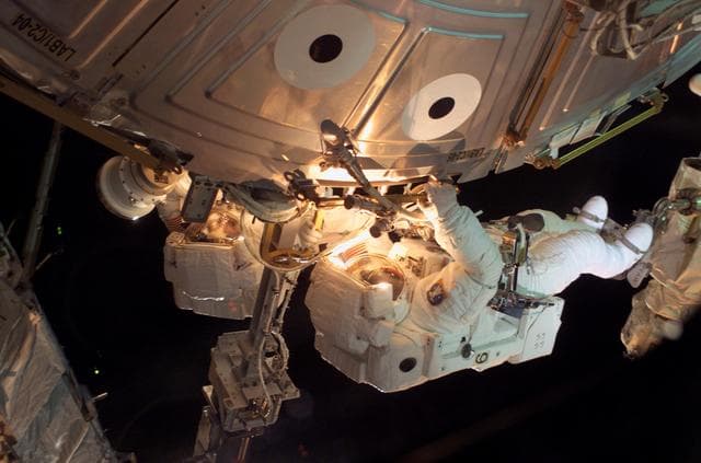 NASA image: MS Sellers connects cables during EVA 2