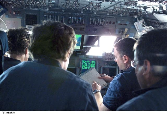 NASA image: STS-114 crew on flight deck during rendezvous and docking operations