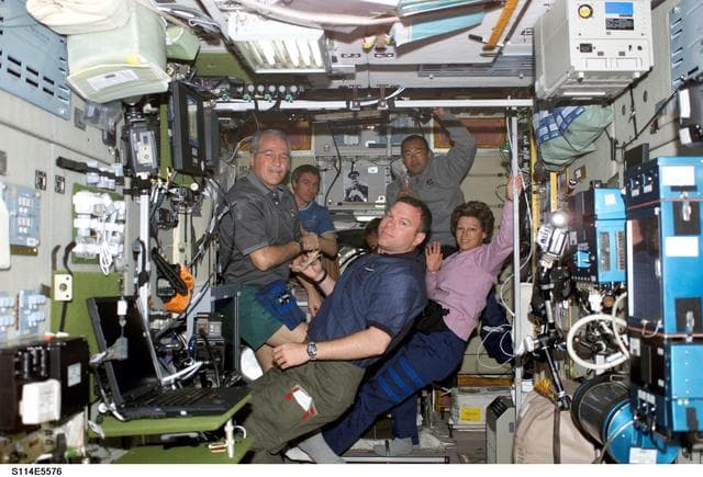 NASA image: STS-114 and Expedition 11 crew during a break in Zvezda Service module