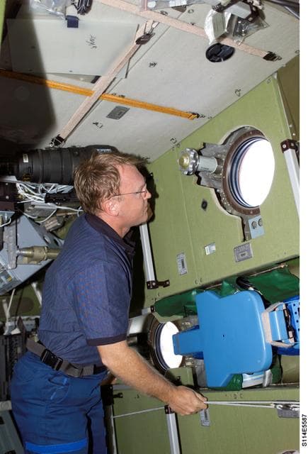 NASA image: Thomas looks through Zvezda window