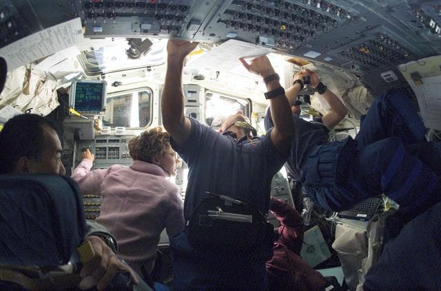 NASA image: STS-114 crew on aft flight deck during rendezvous and docking