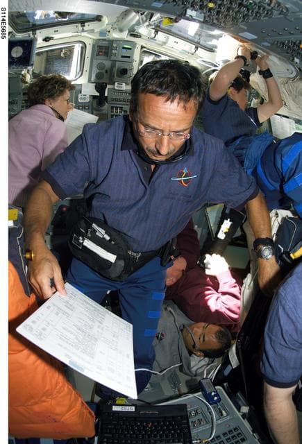 NASA image: STS-114 crew on flight deck during rendezvous and docking