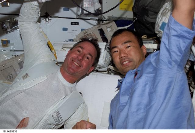 NASA image: Robinson and Noguchi on middeck