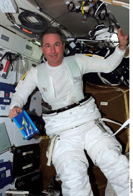 NASA image: Robinson on middeck with EMU
