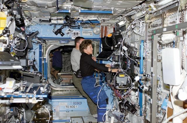NASA image: Kelly and Lawrence at SSRMS controls in Destiny laboratory module