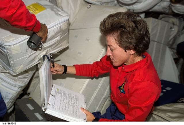 NASA image: Lawrence reviews inventory inside Raffaello