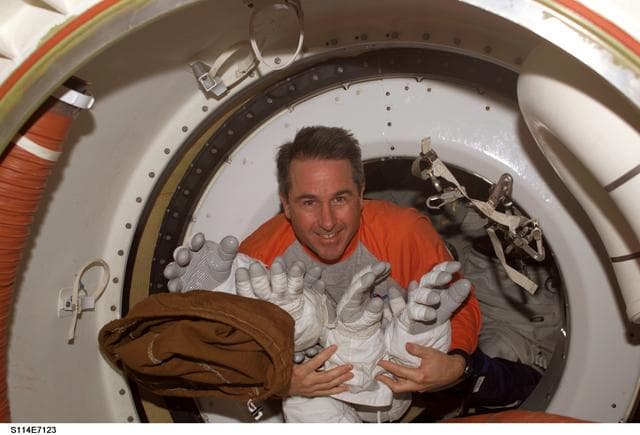 NASA image: Robinson with EMU gloves