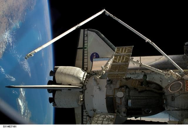 NASA image: Shuttle and SSRMS arm
