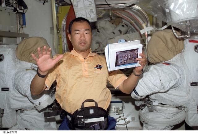 NASA image: Noguchi in Quest airlock during final preparations for undocking