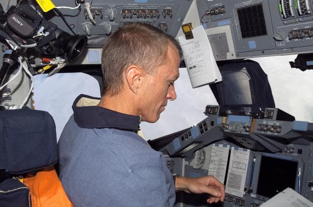 NASA image: STS-115 Commander Jett on the FD of the Space Shuttle Atlantis as it approaches the ISS