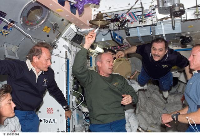 NASA image: Expedition 13 and STS-115 crewmembers reunite after docking with the ISS