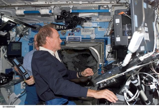 NASA image: MacLean and Williams work at the Robotic Arm in the U.S. Laboratory during STS-115 EVA